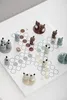 A board game with animal-shaped pieces on a white board. Produktbild-Vorschau