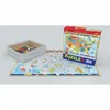 A jigsaw puzzle of the United States of America is laid out on a surface, with some pieces scattered and a box and tray of pieces nearby. Anteprima dell’immagine prodotto
