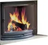 A close-up view of a fireplace with burning logs visible through a curved glass door. Náhľad obrázku produktu