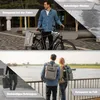 Collage showing a man with a bicycle and a couple by a river, with text overlays highlighting product features. Produktbild-Vorschau