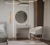 A bedroom scene with a vanity table, mirror, chair, and bed. Anteprima dell’immagine prodotto