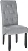A single gray upholstered dining chair with tufted back and black wooden legs, isolated on a white background. Produktbild-Vorschau