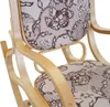 Close-up view of a rocking chair with a floral pattern. Podgląd zdjęcia produktu