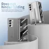 Two folded phone cases are displayed on a tiered white and gray platform against a light blue gradient background. Produktbild-Vorschau