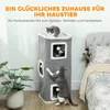 Three cats are interacting with a multi-level cat scratching tower in a bedroom setting. Produktbild-Vorschau