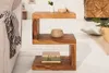 A wooden side table with books and decorative items in a living room setting. Produktbild-Vorschau