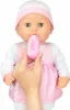 A baby doll is being fed a bottle. Podgląd zdjęcia produktu