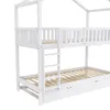 A white wooden bunk bed with a house-shaped frame, a ladder, and a pull-out trundle bed is shown against a white background. Náhľad obrázku produktu