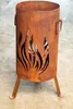 A rusty metal fire pit with flame cutouts and three legs. Produktbild-Vorschau