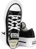 A pair of black Converse platform sneakers with white laces and soles, shown from a slightly angled front view. Voir les images du produit