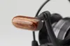 A close-up shot of a fishing reel handle. Podgląd zdjęcia produktu