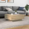 A living room scene with a couch, coffee table, and plant. Náhľad obrázku produktu