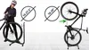 A person is shown assembling a bicycle on a stand, with diagrams indicating wheel size compatibility. Náhľad obrázku produktu