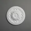 A white decorative rosette is shown against a gray background. Produktbild-Vorschau