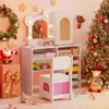 A child's vanity desk with a chair, decorated for Christmas with a wreath, Santa, and a Christmas tree. Produktbild-Vorschau
