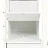 A close-up view of an open compartment in a white wooden cabinet. Produktbild-Vorschau