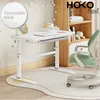 A child's desk and chair in a room setting, with a bookshelf in the background. Produktbild-Vorschau
