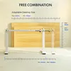 A white adjustable desk frame is shown with a wooden desktop panel. The image includes diagrams and text indicating adaptable desktop sizes and height ranges. Náhled obrázku produktu