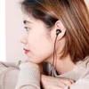 A woman wearing earphones, resting her chin on her hands. Podgląd zdjęcia produktu