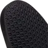 A close-up view of the textured sole of a black shoe. Voir les images du produit