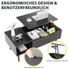 A black coffee table with its top lifted to reveal storage space, showing a laptop, books, and drinks. A hand is shown interacting with a drawer. Voir les images du produit