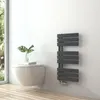 A modern bathroom with a wall-mounted toilet and a dark gray towel radiator. Produktbild-Vorschau
