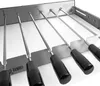 A set of stainless steel skewers with black handles, mounted on a metal rack. Podgląd zdjęcia produktu