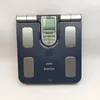 A blue Omron Karada Scan body composition scale is shown from a top-down perspective against a white background. Podgląd zdjęcia produktu