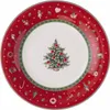 A Christmas-themed plate with a decorated Christmas tree in the center and various Christmas ornaments around the rim. Voir les images du produit
