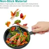 A hand holding a frying pan with food ingredients flying into it. Náhled obrázku produktu