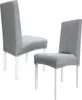 Two gray chair covers on white legs against a white background. Náhled obrázku produktu
