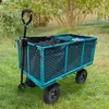 A teal garden wagon with a black liner and black wheels sits on a grassy lawn, with green bushes and trees in the background. Voir les images du produit