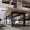 An office environment with a long wooden table and chairs. Produktbild-Vorschau