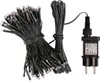 A bundle of black LED string lights with a power adapter. Produktbild-Vorschau