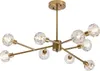 A gold-colored chandelier with clear glass globes, suspended from a white background. Podgląd zdjęcia produktu