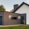 Exterior view of a modern house with two wall-mounted LED lights. Produktbild-Vorschau