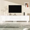 A white TV stand with a television mounted above it in a living room setting. Podgląd zdjęcia produktu
