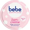 A close-up of the lid of a Bebe Zartpflege Zartcreme product, featuring the brand logo and product name against a pink background with white polka dots. Náhľad obrázku produktu