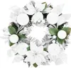 A white Christmas wreath with poinsettias, ornaments, and pine branches. Anteprima dell’immagine prodotto
