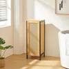 A laundry basket in a bathroom setting next to a bathtub. Podgląd zdjęcia produktu