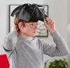 A young boy is putting on a Darth Vader mask. Anteprima dell’immagine prodotto