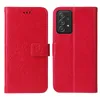A red flip phone case with a floral and butterfly embossed design is shown open, revealing the inside, next to the same case closed, showing the phone it protects. Produktbild-Vorschau