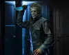 A figure of Michael Myers holding a knife in a dimly lit room. Náhled obrázku produktu