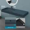 A dark gray rectangular washbasin is mounted on a light blue wall, with a mirror above it. Inset images highlight features like overflow protection. Produktbild-Vorschau