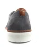 The back view of a grey suede sneaker with brown leather accents. Produktbild-Vorschau