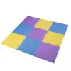 A colorful puzzle mat made of interlocking foam squares. Voir les images du produit