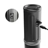 Close-up view of a portable coffee machine with a USB-C port and a connected charging cable. Produktbild-Vorschau