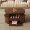 A coffee table with storage in a living room setting. Produktbild-Vorschau