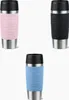 Three travel mugs in different colors arranged in a triangular formation against a white background. Produktbild-Vorschau