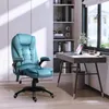 A teal office chair is placed next to a desk in a well-lit room with a bookshelf and a window. Náhľad obrázku produktu